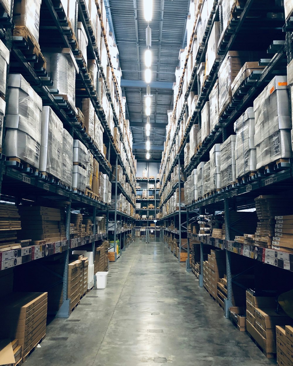 Logistics team moving goods through a distribution facility.