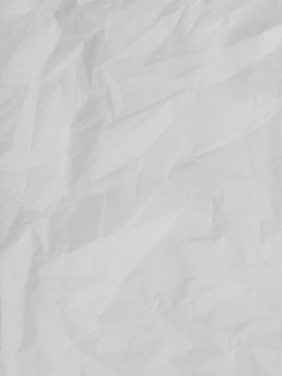 Stack of kraft paper sheets with a warm natural texture.